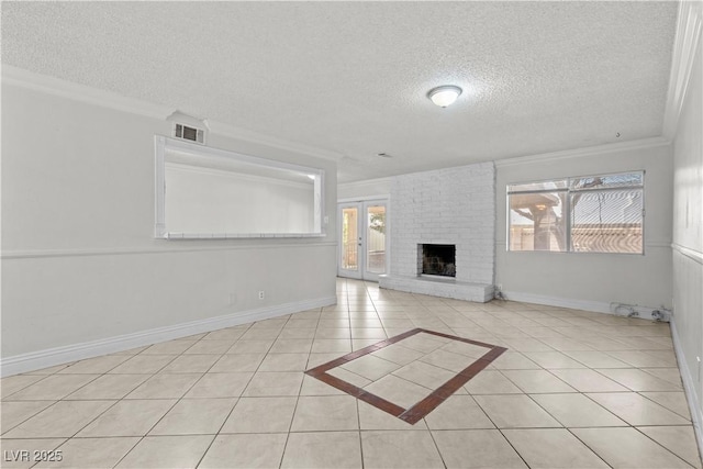 5101 Churchill Ave, Las Vegas, NV 89107 - unfurnished living room with a textured ceiling, light tile patterned floors, crown molding, a brick fireplace, and baseboards