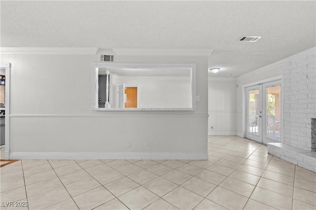 5101 Churchill Ave, Las Vegas, NV 89107 - spare room with crown molding, a textured ceiling, french doors, baseboards, and light tile patterned floors