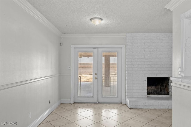 5101 Churchill Ave, Las Vegas, NV 89107 - doorway to outside featuring french doors, a textured ceiling, light tile patterned floors, a brick fireplace, and ornamental molding