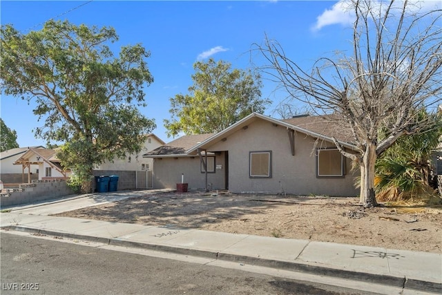 5101 Churchill Ave, Las Vegas, NV 89107 - view of front of house with stucco siding, driveway, and a garage