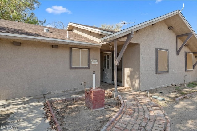 5101 Churchill Ave, Las Vegas, NV 89107 - entrance to property featuring stucco siding and roof with shingles