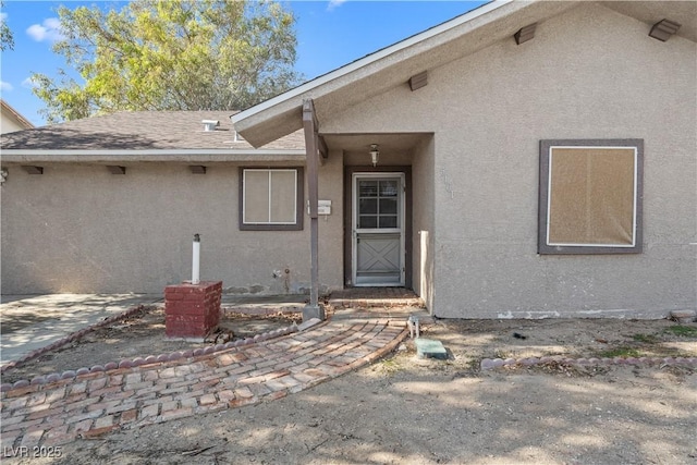 5101 Churchill Ave, Las Vegas, NV 89107 - property entrance featuring stucco siding and roof with shingles