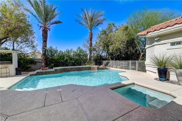 2345 Villandry Ct, Henderson, NV 89074 - view of swimming pool with an in-ground hot tub, a patio area, and a fenced backyard