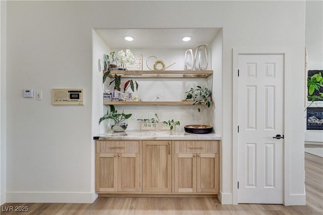 2345 Villandry Ct, Henderson, NV 89074 - indoor wet bar with light wood finished floors and baseboards
