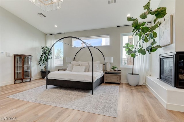 2345 Villandry Ct, Henderson, NV 89074 - bedroom with light wood finished floors, multiple windows, and recessed lighting