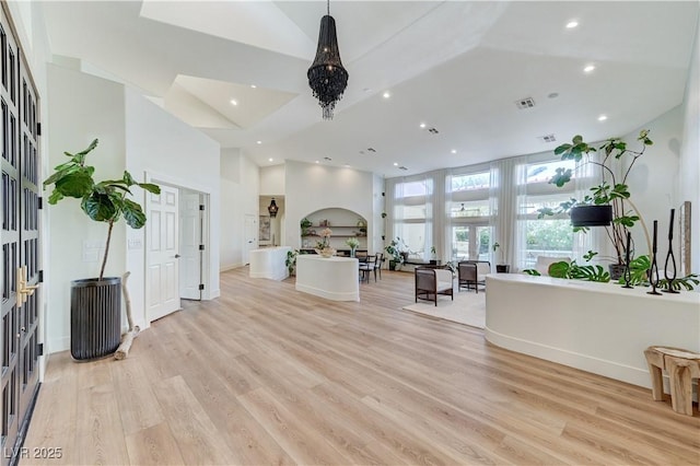 2345 Villandry Ct, Henderson, NV 89074 - living room featuring recessed lighting, light wood-style flooring, and high vaulted ceiling
