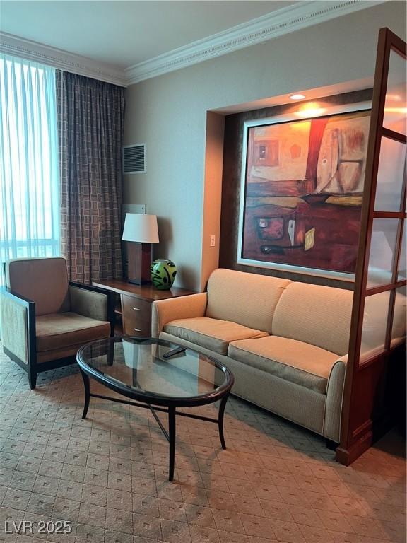 145 E Harmon Ave Unit 2409, Las Vegas, NV 89109 - living area featuring ornamental molding and tile patterned floors