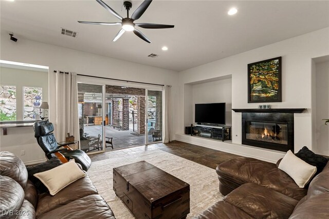 48 Panorama Crest Ave, Las Vegas, NV 89135 - living area featuring recessed lighting, ceiling fan, baseboards, a glass covered fireplace, and wood finished floors