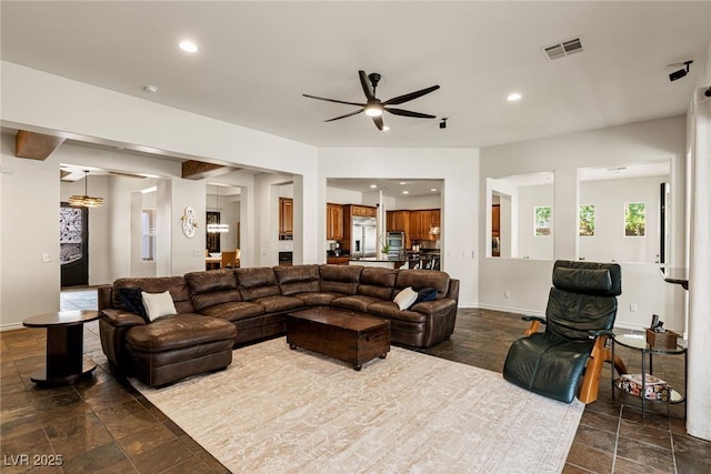 48 Panorama Crest Ave, Las Vegas, NV 89135 - living room featuring stone tile flooring, a ceiling fan, recessed lighting, and baseboards