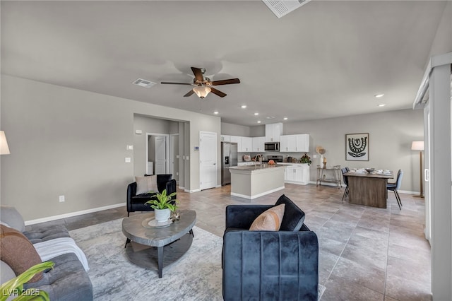 9876 Magnus Ct, Las Vegas, NV 89178 - living room with a ceiling fan, baseboards, and recessed lighting