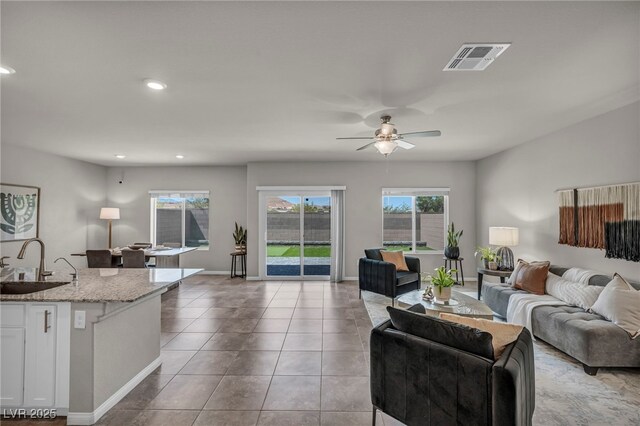 9876 Magnus Ct, Las Vegas, NV 89178 - living area featuring a ceiling fan, recessed lighting, tile patterned flooring, and baseboards