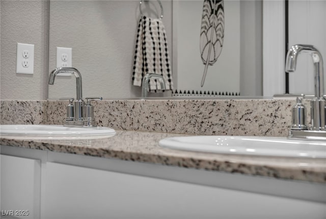 9876 Magnus Ct, Las Vegas, NV 89178 - bathroom with double vanity and a textured wall