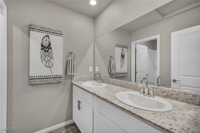 9876 Magnus Ct, Las Vegas, NV 89178 - full bath featuring double vanity and baseboards