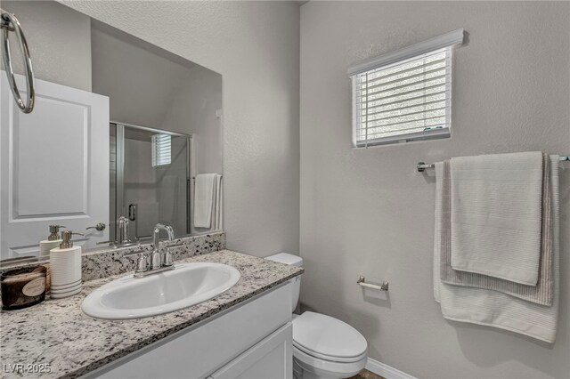 9876 Magnus Ct, Las Vegas, NV 89178 - full bath featuring vanity, toilet, and a shower stall