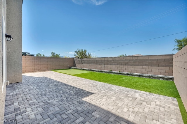 9876 Magnus Ct, Las Vegas, NV 89178 - fenced backyard featuring a patio area