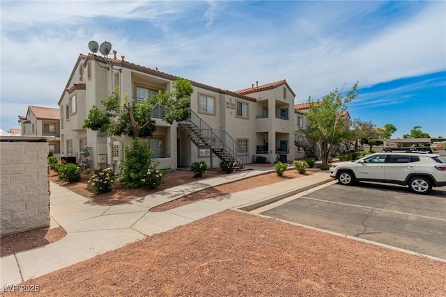 3318 N Decatur Blvd Unit 1020, Las Vegas, NV 89130 - view of property with stairs and uncovered parking