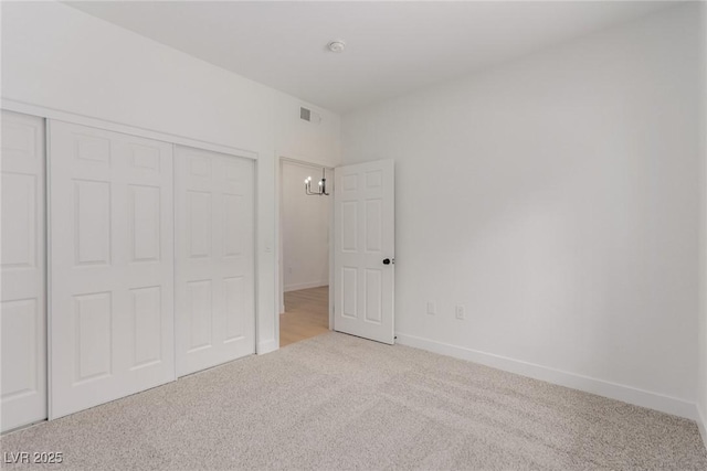 3318 N Decatur Blvd Unit 1020, Las Vegas, NV 89130 - unfurnished bedroom featuring carpet floors, a closet, and baseboards