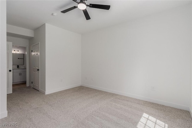 3318 N Decatur Blvd Unit 1020, Las Vegas, NV 89130 - unfurnished bedroom with carpet flooring, baseboards, ensuite bath, and a ceiling fan