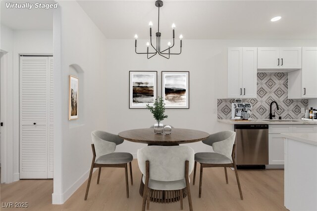 3318 N Decatur Blvd Unit 1020, Las Vegas, NV 89130 - dining space with light wood-style flooring, a chandelier, recessed lighting, and baseboards