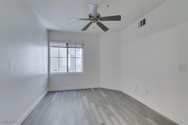 7151 S Durango Dr Unit 211, Las Vegas, NV 89113 - unfurnished room with light wood finished floors, a ceiling fan, and baseboards