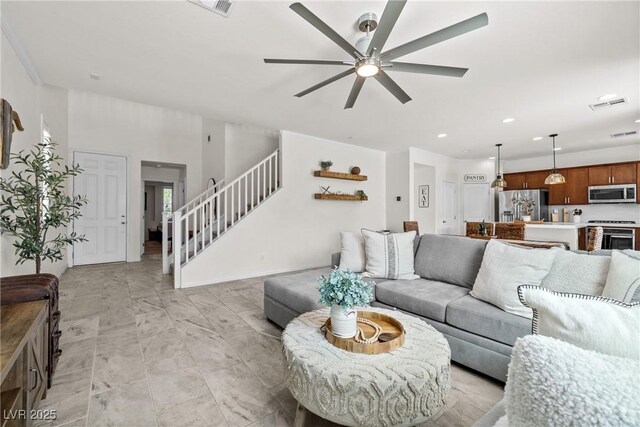 10474 Palmadora St, Las Vegas, NV 89178 - living room with stairs, ceiling fan, and recessed lighting