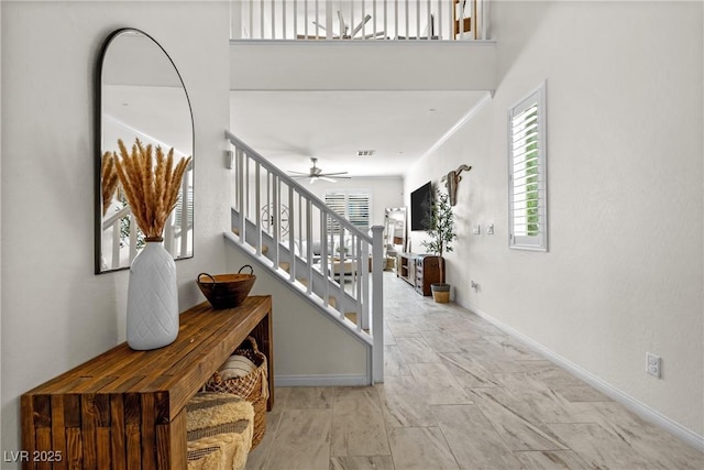 10474 Palmadora St, Las Vegas, NV 89178 - foyer entrance featuring plenty of natural light, baseboards, stairway, and ceiling fan