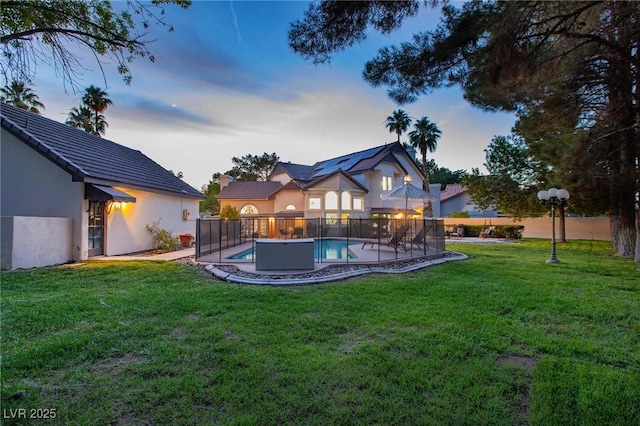15 Pheasant Ridge Dr, Henderson, NV 89014 - back of property at dusk featuring stucco siding