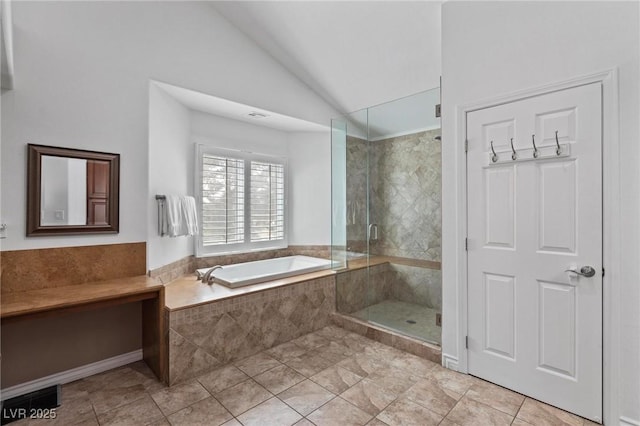 15 Pheasant Ridge Dr, Henderson, NV 89014 - full bathroom with a bath, vaulted ceiling, a stall shower, and tile patterned flooring