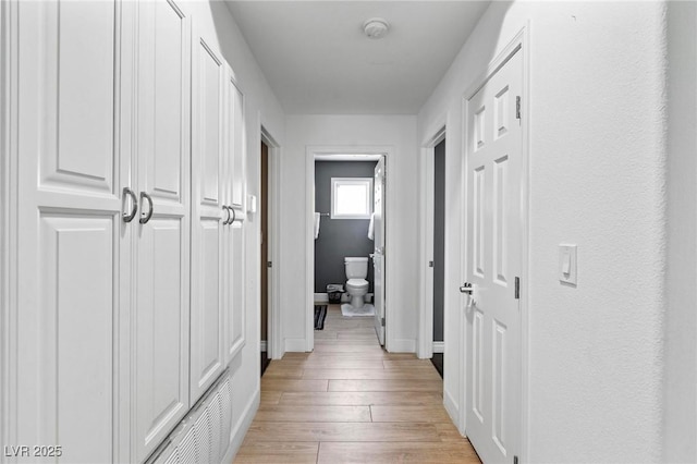 15 Pheasant Ridge Dr, Henderson, NV 89014 - corridor featuring baseboards and light wood finished floors