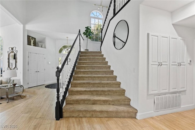 15 Pheasant Ridge Dr, Henderson, NV 89014 - stairs with wood finished floors and a high ceiling