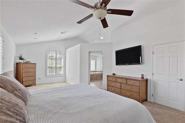15 Pheasant Ridge Dr, Henderson, NV 89014 - bedroom with light carpet, vaulted ceiling, ensuite bathroom, ceiling fan, and baseboards