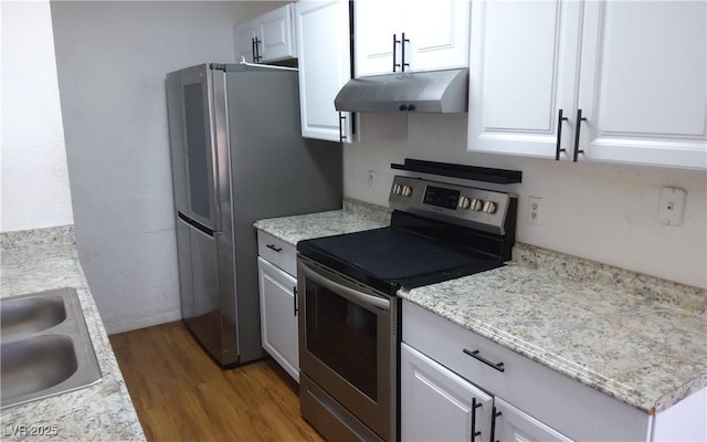 3441 Villa Way, Las Vegas, NV 89120 - kitchen with stainless steel appliances, under cabinet range hood, wood finished floors, white cabinets, and light countertops