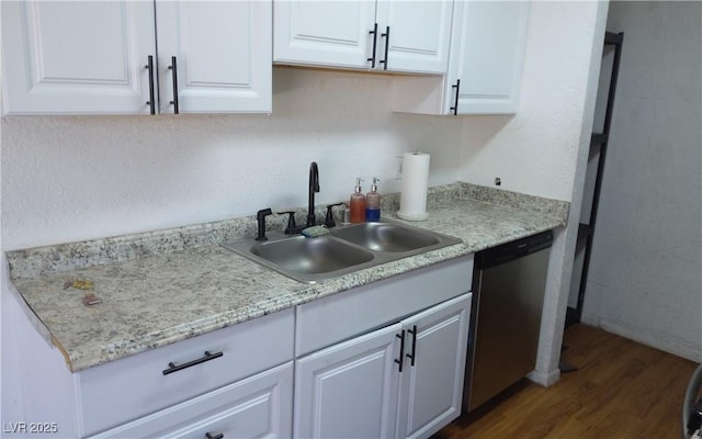 3441 Villa Way, Las Vegas, NV 89120 - kitchen with stainless steel dishwasher, dark wood-style floors, light countertops, and white cabinetry