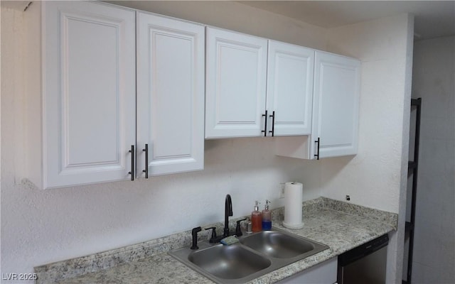 3441 Villa Way, Las Vegas, NV 89120 - kitchen featuring dishwasher, white cabinetry, and light countertops