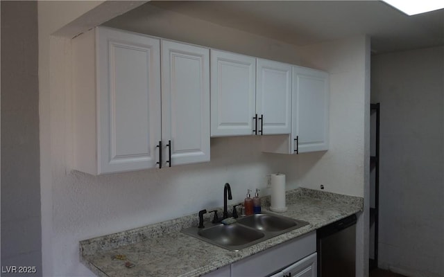 3441 Villa Way, Las Vegas, NV 89120 - kitchen featuring dishwasher, light countertops, and white cabinetry