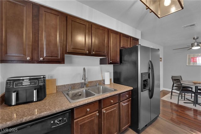 2451 N Rainbow Blvd Unit 2043, Las Vegas, NV 89108 - kitchen with stainless steel fridge, dishwasher, wood finished floors, a ceiling fan, and dark brown cabinetry