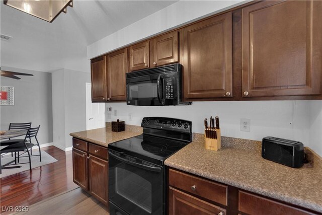 2451 N Rainbow Blvd Unit 2043, Las Vegas, NV 89108 - kitchen with black appliances, dark wood-style floors, and a ceiling fan