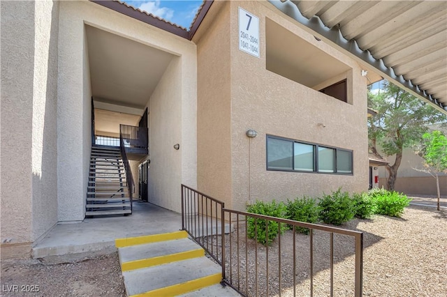 2451 N Rainbow Blvd Unit 2043, Las Vegas, NV 89108 - doorway to property featuring stucco siding