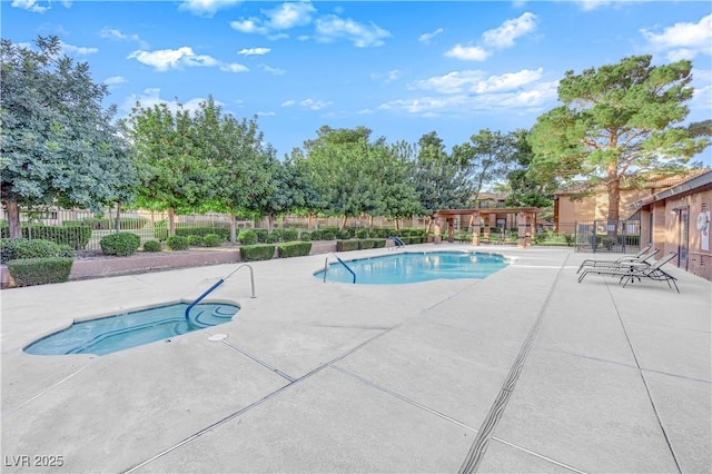 2451 N Rainbow Blvd Unit 2043, Las Vegas, NV 89108 - community pool with a patio and a hot tub
