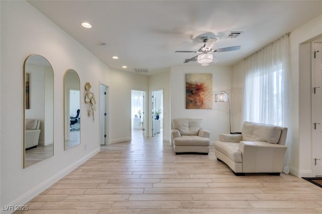 8221 Bay Dunes St, Las Vegas, NV 89131 - sitting room featuring light wood-style flooring, plenty of natural light, arched walkways, and recessed lighting