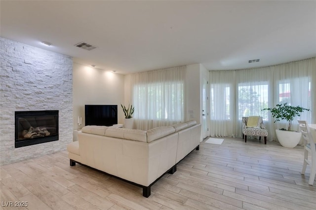 8221 Bay Dunes St, Las Vegas, NV 89131 - living area featuring light wood finished floors and a fireplace
