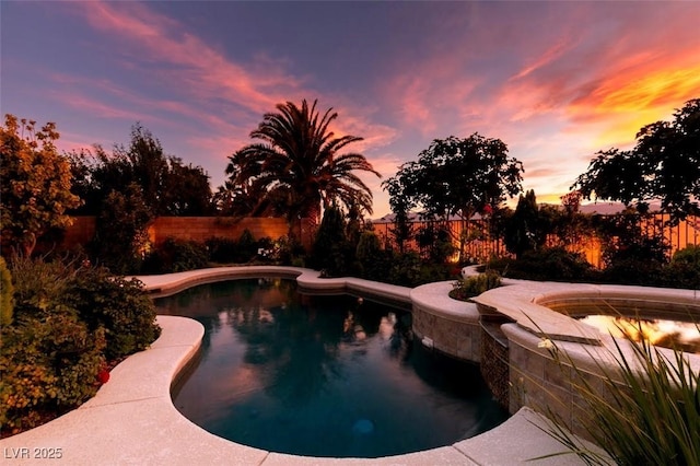 8221 Bay Dunes St, Las Vegas, NV 89131 - pool at dusk featuring a fenced backyard