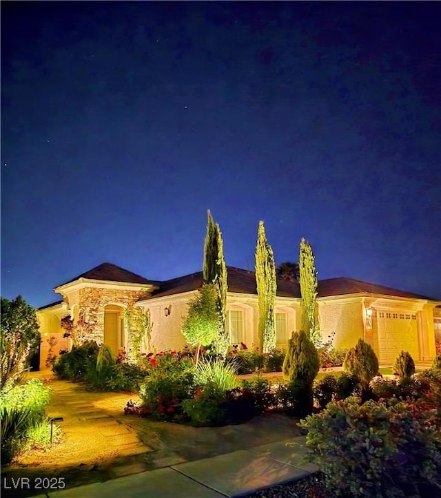 8221 Bay Dunes St, Las Vegas, NV 89131 - view of front facade featuring an attached garage and stucco siding
