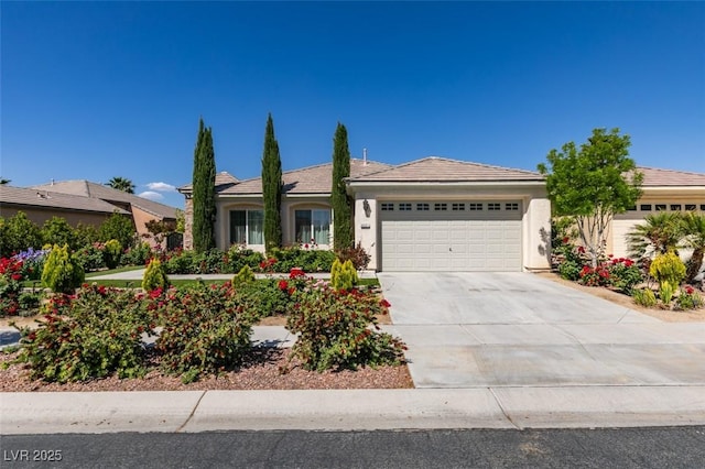 8221 Bay Dunes St, Las Vegas, NV 89131 - view of front facade with a garage, driveway, stucco siding, and a tile roof