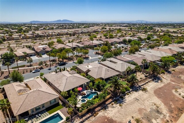 8221 Bay Dunes St, Las Vegas, NV 89131 - aerial perspective of suburban area with a pool and mountains
