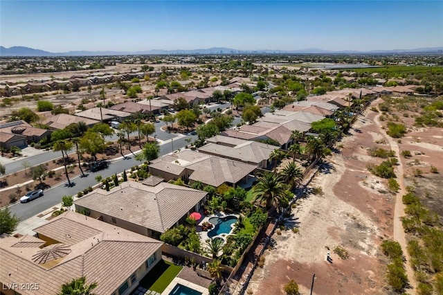 8221 Bay Dunes St, Las Vegas, NV 89131 - aerial perspective of suburban area featuring a pool and mountains