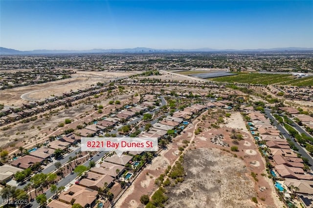 8221 Bay Dunes St, Las Vegas, NV 89131 - aerial overview of property's location featuring a mountainous background and nearby suburban area