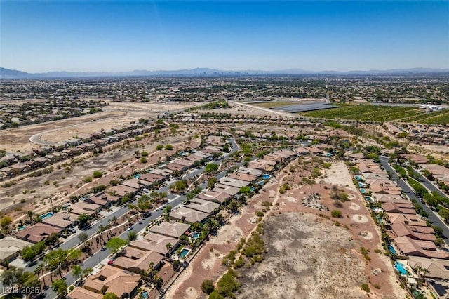 8221 Bay Dunes St, Las Vegas, NV 89131 - aerial view of property and surrounding area with a mountain backdrop and nearby suburban area