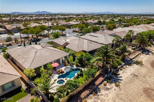 8221 Bay Dunes St, Las Vegas, NV 89131 - aerial view of residential area with a pool and a mountainous background