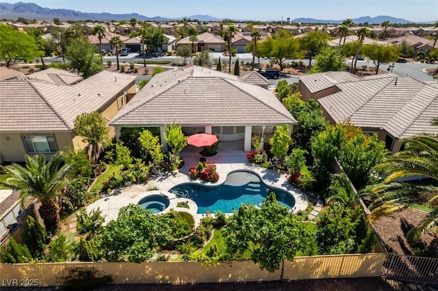 8221 Bay Dunes St, Las Vegas, NV 89131 - aerial perspective of suburban area featuring a pool area and a mountain backdrop
